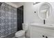 Modern bathroom with patterned tile and a white vanity at 5714 N 19Th Dr, Phoenix, AZ 85015