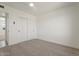 Spacious bedroom with double doors and carpet flooring at 5714 N 19Th Dr, Phoenix, AZ 85015
