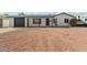 Newly remodeled home with a white exterior and dark gray garage door at 5714 N 19Th Dr, Phoenix, AZ 85015