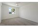 Bright bedroom with ceiling fan and neutral carpeting at 5714 N 19Th Dr, Phoenix, AZ 85015