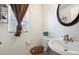 Small bathroom with toilet and pedestal sink at 1210 S 121St Dr, Avondale, AZ 85323