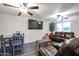 Bright living room with gray dining table and brown couches at 18202 N Cave Creek Rd # 115, Phoenix, AZ 85032