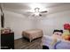 Cozy bedroom featuring a bed, window coverings, and neutral decor at 18202 N Cave Creek Rd # 115, Phoenix, AZ 85032