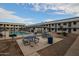 Community pool area with tables, grills, and ample space for relaxation at 18202 N Cave Creek Rd # 115, Phoenix, AZ 85032