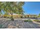 Landscaped backyard with gravel and mature trees at 12946 W Ashwood Dr, Sun City West, AZ 85375