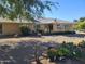 Charming backyard with gravel landscaping, desert plants, and patio area at 12946 W Ashwood Dr, Sun City West, AZ 85375