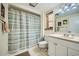 Clean bathroom with shower/tub combo, white vanity, and tile floor at 12946 W Ashwood Dr, Sun City West, AZ 85375