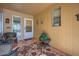Cozy entryway with wicker chairs and a patterned rug at 12946 W Ashwood Dr, Sun City West, AZ 85375