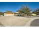 Single story home with a two-car garage and landscaped front yard at 12946 W Ashwood Dr, Sun City West, AZ 85375