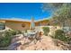 Spacious front patio with seating area and umbrella, great for entertaining at 12946 W Ashwood Dr, Sun City West, AZ 85375