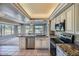 Bright kitchen, granite counters, island, golf course view at 12946 W Ashwood Dr, Sun City West, AZ 85375