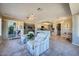 Open concept living room, kitchen, and dining area with patio access at 12946 W Ashwood Dr, Sun City West, AZ 85375