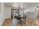 Modern dining room with hardwood floors and a chandelier at 4335 E Montecito Ave, Phoenix, AZ 85018