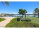 Beautiful lake view with homes and lush greenery at 40010 W Bravo Dr, Maricopa, AZ 85138