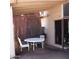Covered patio with white table and chairs, ideal for outdoor dining at 4622 N 71St Ln, Phoenix, AZ 85033