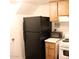Kitchen area with black refrigerator and stove at 4622 N 71St Ln, Phoenix, AZ 85033