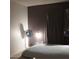 Bedroom with a bed, fan, and dark-colored walls at 4622 N 71St Ln, Phoenix, AZ 85033