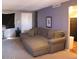 Spacious living room featuring a large sectional sofa and neutral color palette at 4622 N 71St Ln, Phoenix, AZ 85033