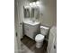 Updated bathroom with white vanity, toilet and modern fixtures at 15075 W Amelia Dr, Goodyear, AZ 85395