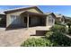 Spacious patio with flagstone flooring and covered seating area at 15075 W Amelia Dr, Goodyear, AZ 85395