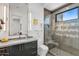Modern bathroom with glass shower and gray tile at 30505 N Sage Dr, Peoria, AZ 85383