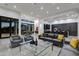Open living space with modern furniture and kitchen views at 30505 N Sage Dr, Peoria, AZ 85383