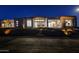 Stunning modern home with attractive landscaping at night at 30505 N Sage Dr, Peoria, AZ 85383