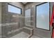 Walk-in shower with gray tile and built-in seat at 30505 N Sage Dr, Peoria, AZ 85383