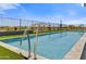 Modern rectangular pool with metal railing and artificial turf at 30505 N Sage Dr, Peoria, AZ 85383