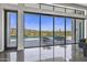 Living area with glass doors opening to a pool and patio at 30505 N Sage Dr, Peoria, AZ 85383