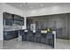 Sleek kitchen with dark cabinetry and stainless steel appliances at 30505 N Sage Dr, Peoria, AZ 85383