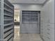 Organized walk-in closet with shelving, drawers and shoe storage at 30505 N Sage Dr, Peoria, AZ 85383