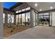 Modern courtyard with a metal sculpture and views into the home at 30505 N Sage Dr, Peoria, AZ 85383