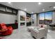 Basement recreation room with fireplace and large windows at 30505 N Sage Dr, Peoria, AZ 85383