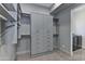 Spacious walk-in closet with custom shelving and drawers at 30505 N Sage Dr, Peoria, AZ 85383