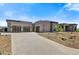 Contemporary home with large windows and attached garage at 30505 N Sage Dr, Peoria, AZ 85383