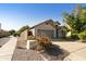 Exterior view showing the house's front and side, with a walkway and landscaping at 3053 E Knoll St, Mesa, AZ 85213