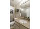 Bathroom features granite countertop, updated vanity, and a large mirror at 3053 E Knoll St, Mesa, AZ 85213