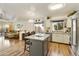 Kitchen features an island, stainless steel appliances, and white cabinets at 3053 E Knoll St, Mesa, AZ 85213