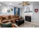 Cozy living room featuring a fireplace and sectional sofa at 1825 W Ray Rd # 1001, Chandler, AZ 85224
