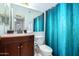 Bathroom with teal shower curtain and updated vanity at 1825 W Ray Rd # 1001, Chandler, AZ 85224
