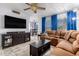 Relaxing living room with a sectional sofa and large TV at 1825 W Ray Rd # 1001, Chandler, AZ 85224