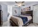 King-size bedroom with ceiling fan and ensuite bathroom access at 1825 W Ray Rd # 1001, Chandler, AZ 85224