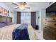 Spacious bedroom with king-size bed and access to balcony at 1825 W Ray Rd # 1001, Chandler, AZ 85224