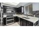 Modern kitchen with dark cabinets and double oven at 1825 W Ray Rd # 1001, Chandler, AZ 85224