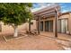 Landscaped backyard with a pergola, seating, and citrus tree at 3345 E University Dr # 2, Mesa, AZ 85213