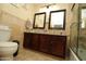 Bathroom with dark wood cabinets and a large vanity at 9450 N 95Th St # 219, Scottsdale, AZ 85258