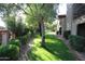 Landscaped grounds with walkways and lush green grass at 9450 N 95Th St # 219, Scottsdale, AZ 85258
