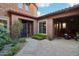 Private courtyard with seating area and fireplace at 27016 N 14Th Ln, Phoenix, AZ 85085
