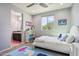 Spacious bedroom with access to a bathroom and hallway at 27016 N 14Th Ln, Phoenix, AZ 85085